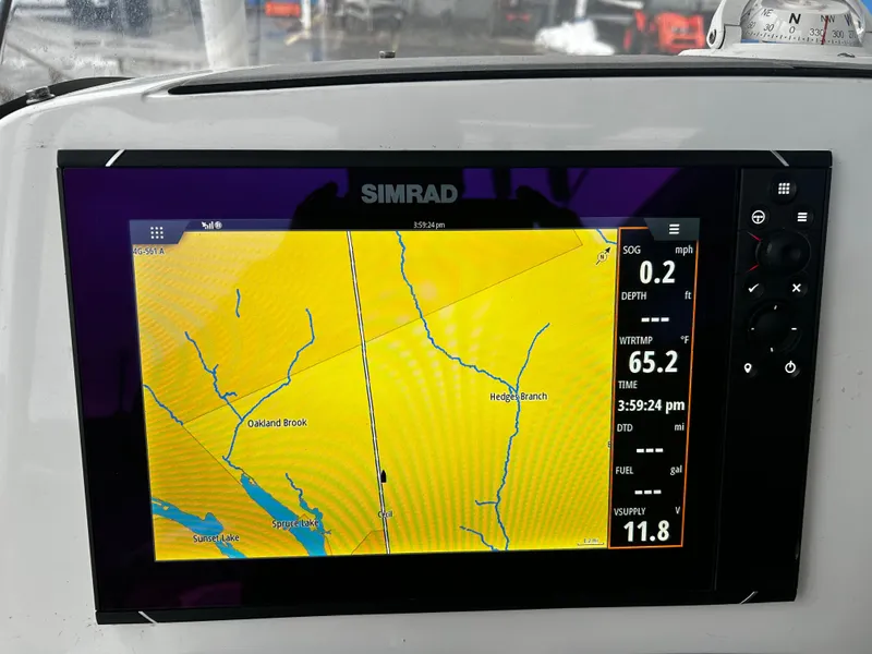 Slide: The Image of Simrad GPS display on 2018 NauticStar 25 XS Offshore boat showing navigation map. - 10