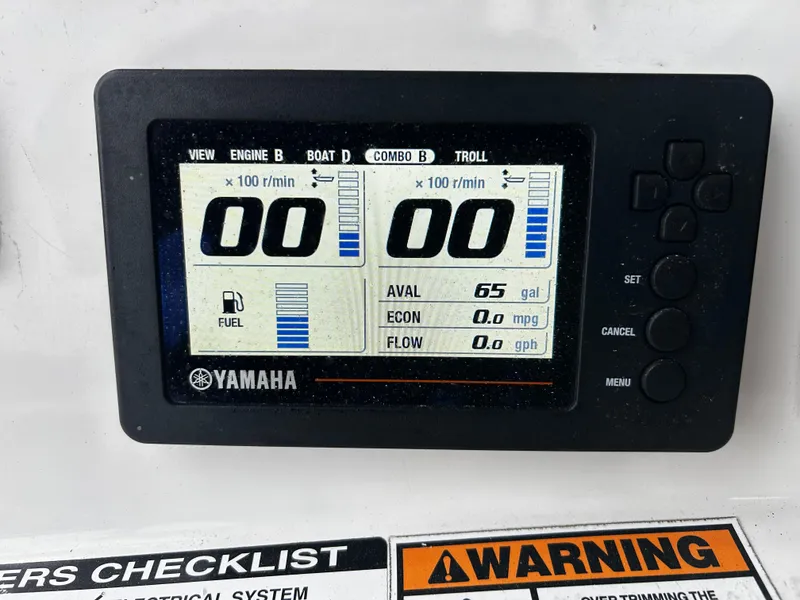 Slide: The Image of Yamaha display on 2018 NauticStar 25 XS Offshore showing fuel and engine data. - 13