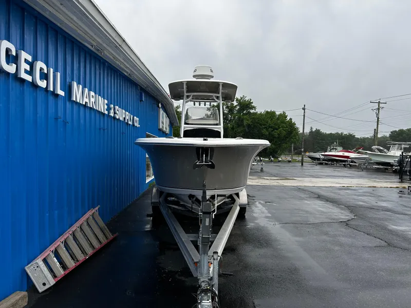 Slide: The Image of 2018 NauticStar 25 XS Offshore boat on trailer at marine supply store. - 6