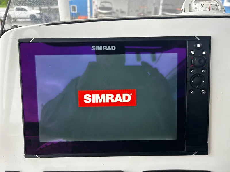 Slide: The Image of Simrad display on 2018 NauticStar 25 XS Offshore boat dashboard. - 9