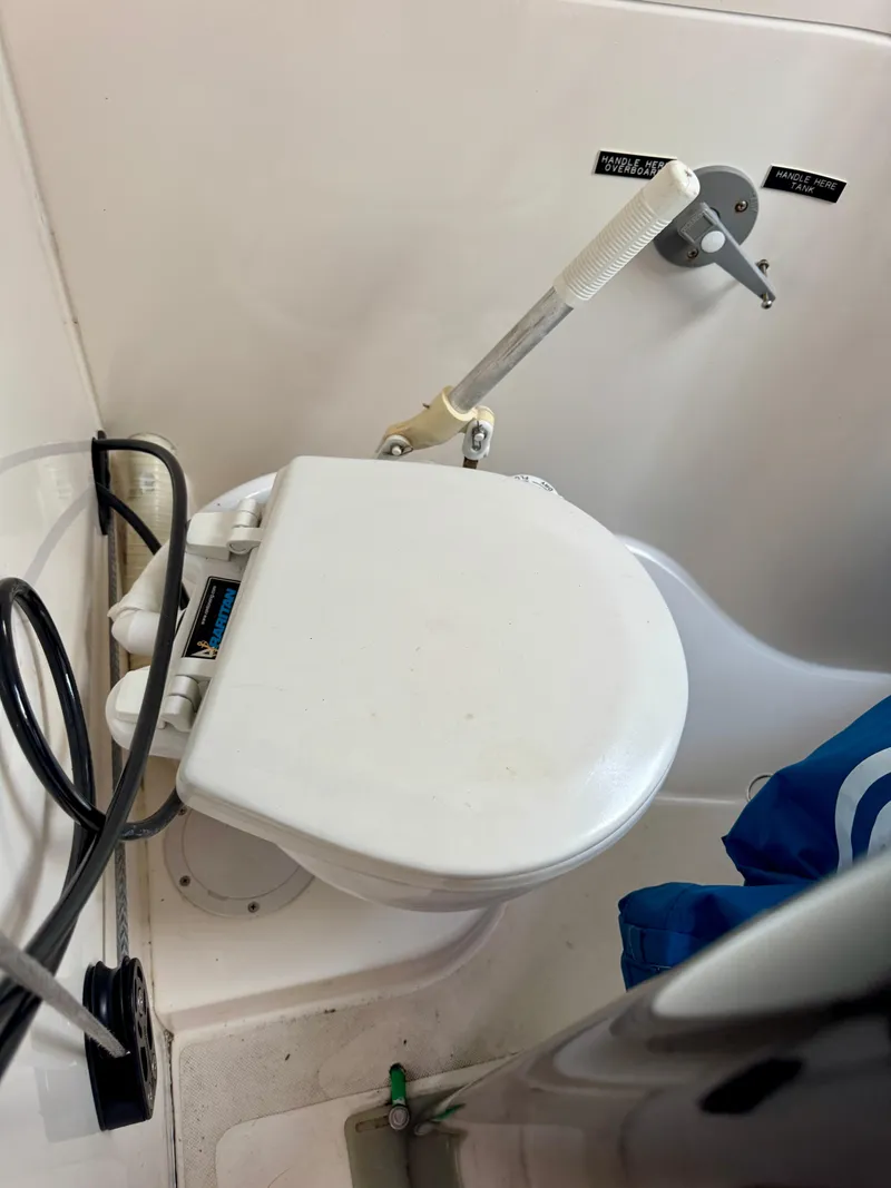 Slide: The Image of 2005 J Boats J/100 marine toilet with manual pump handle. - 18