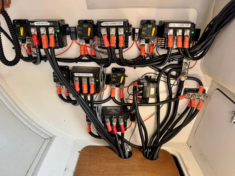 Slide: The Image of Electrical panel with labeled wiring in a 2005 J Boats J/100 sailboat. - 21