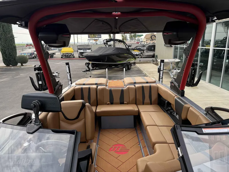 Slide: The Image of 2025 Malibu Wakesetter 22 LSV interior with tan seating and modern design. - 13