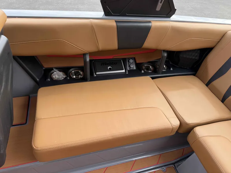 Slide: The Image of 2025 Malibu Wakesetter 22 LSV interior with tan seating and cup holders. - 14