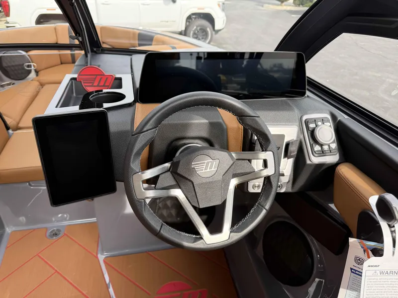 Slide: The Image of 2025 Malibu Wakesetter 22 LSV dashboard with modern steering and digital displays. - 3
