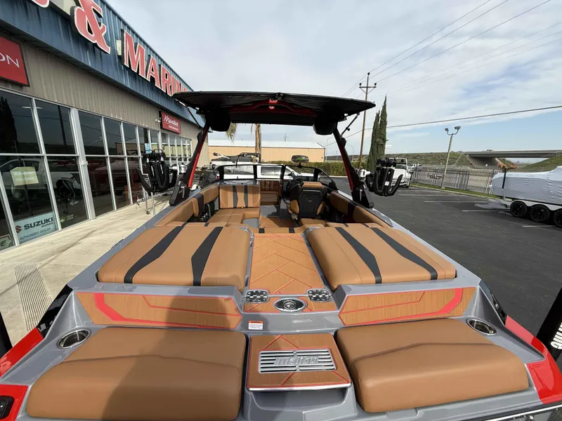 Slide: The Image of 2025 Malibu Wakesetter 22 LSV boat with spacious seating at a dealership. - 7