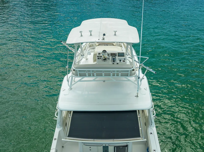 Slide: The Image of 2016 Boston Whaler 420 Outrage boat on clear turquoise water, aerial view. - 23