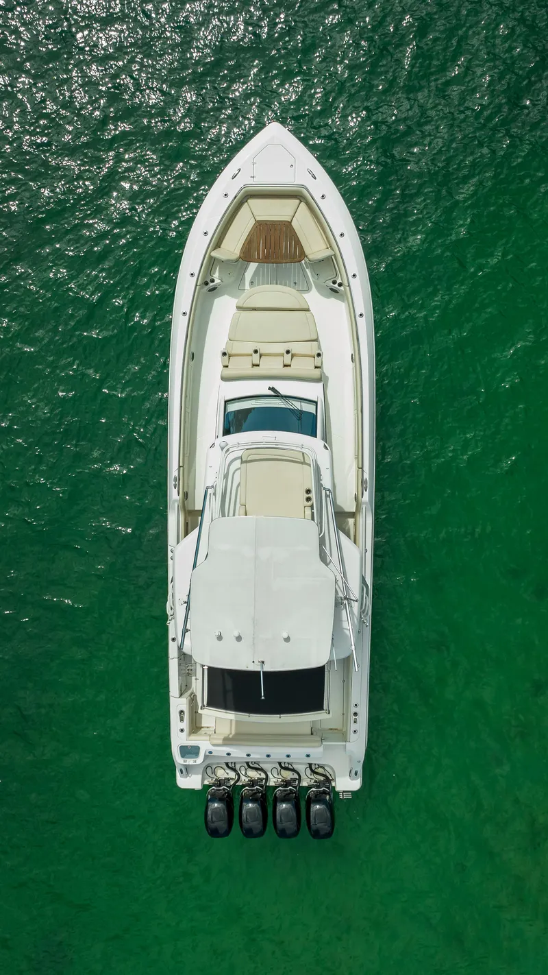 Slide: The Image of Aerial view of 2016 Boston Whaler 420 Outrage boat on green water. - 7