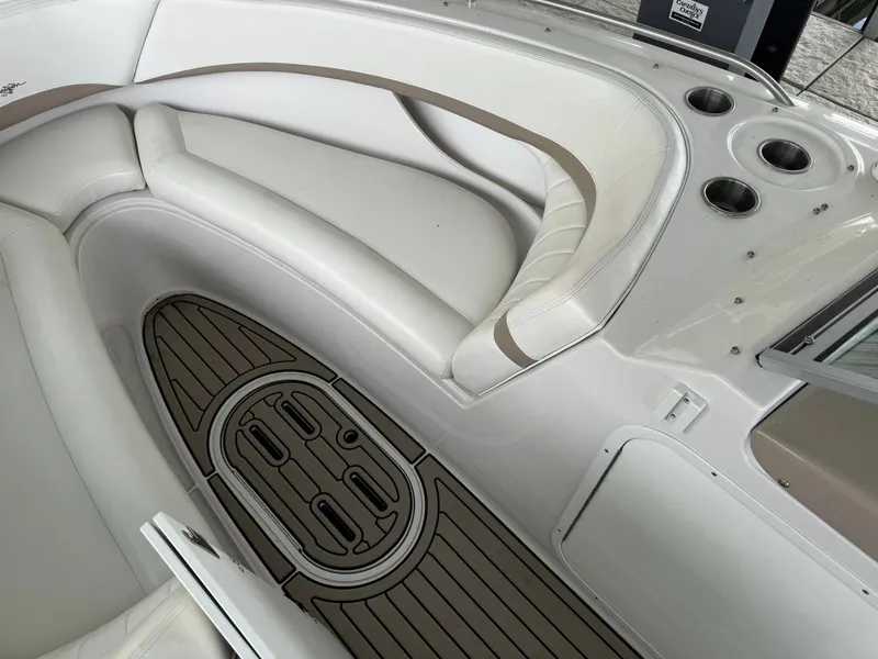 Slide: The Image of Interior of 2006 Four Winns 290 Horizon boat with white seating and wood flooring. - 23