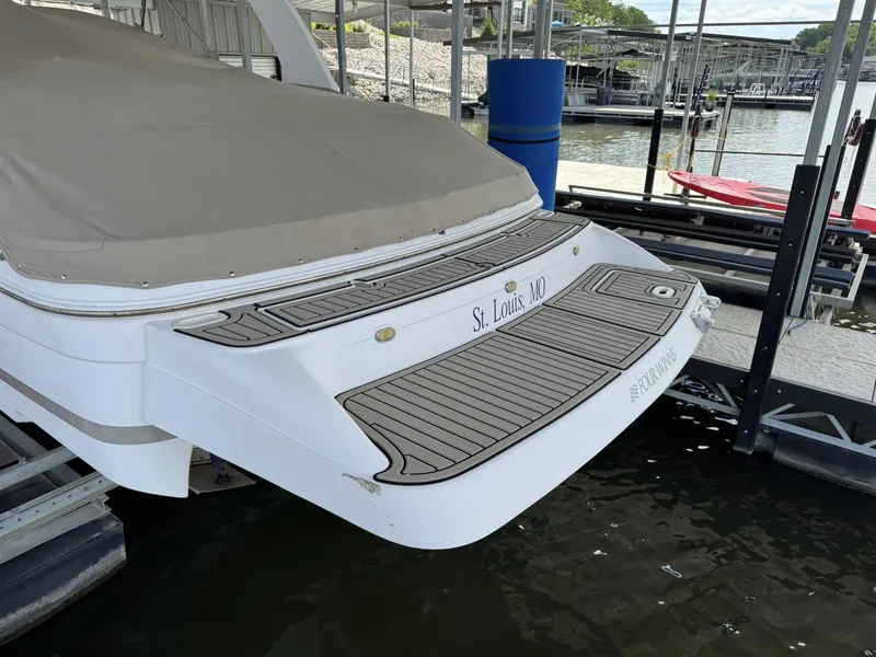 Slide: The Image of 2006 Four Winns 290 Horizon boat docked, covered, with St. Louis, MO marking. - 27