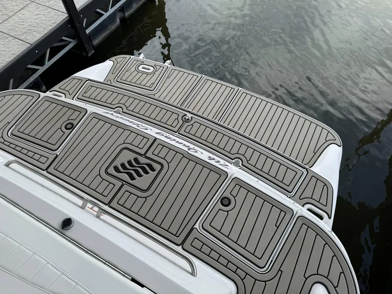 Slide: The Image of 2006 Four Winns 290 Horizon swim platform with custom decking by the water. - 4