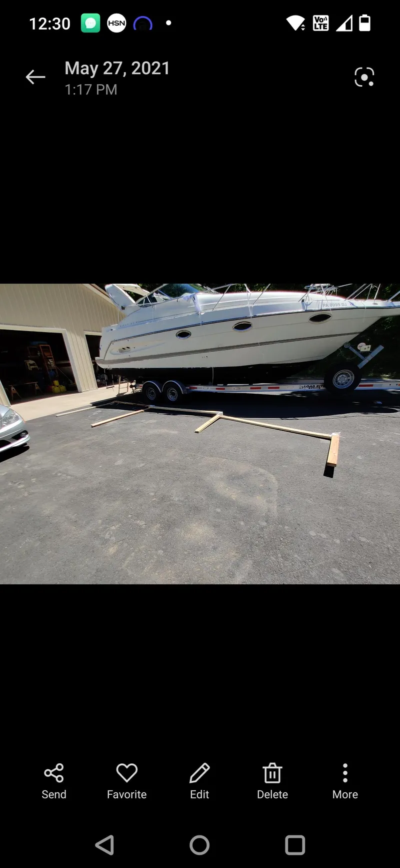 Slide: The Image of 2000 Maxum 2800 SCR boat on trailer in driveway, May 27, 2021. - 15