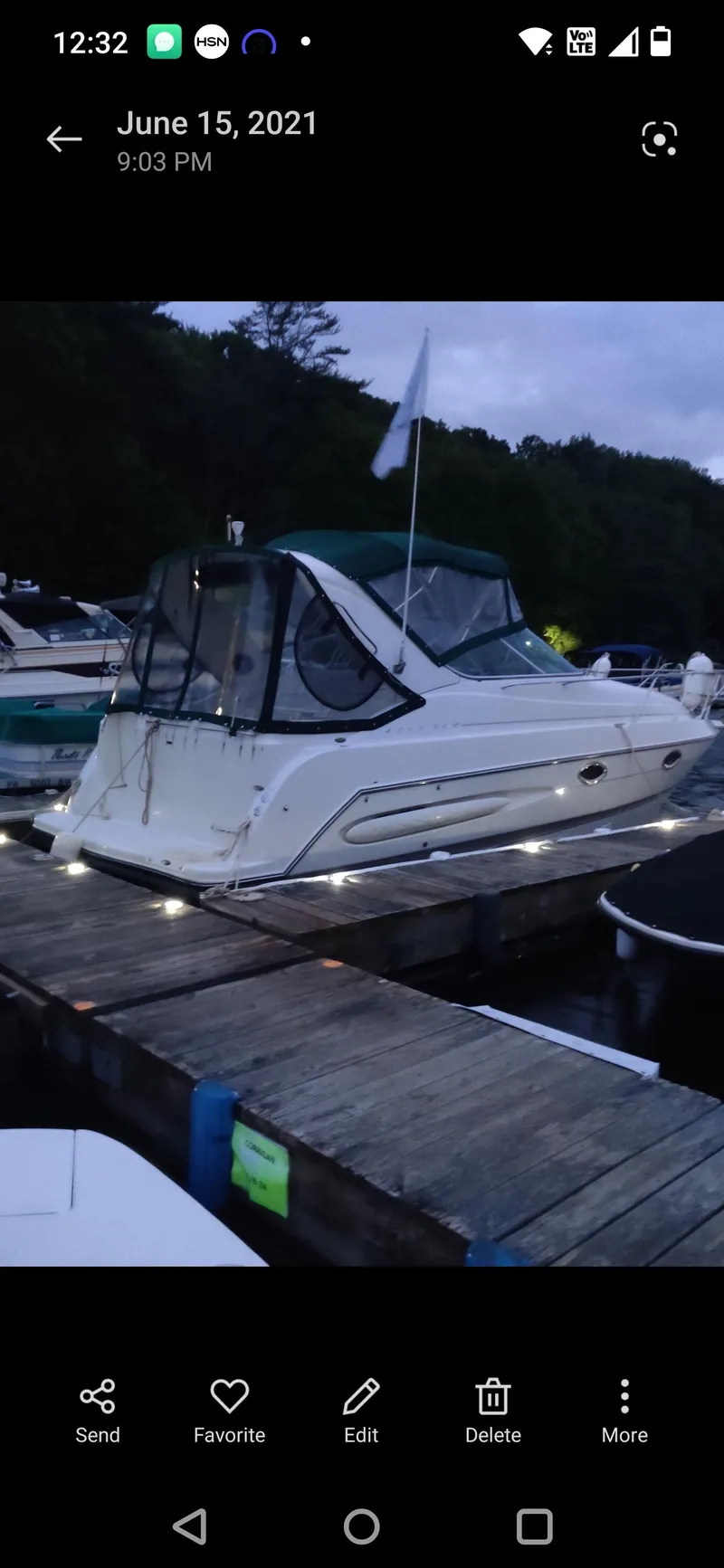 Slide: The Image of 2000 Maxum 2800 SCR boat docked at a marina during evening. - 19