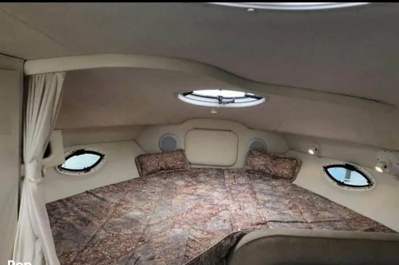 Slide: The Image of Cozy cabin interior of 2000 Maxum 2800 SCR boat with bed and portholes. - 20