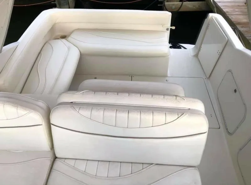 Slide: The Image of 2000 Maxum 2800 SCR boat interior with white leather seating. - 7