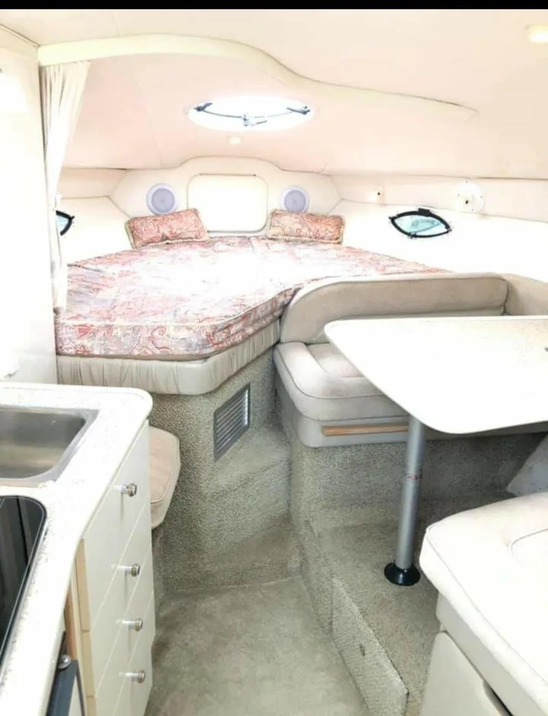 Slide: The Image of Interior of 2000 Maxum 2800 SCR boat with cozy bed and compact kitchenette. - 9