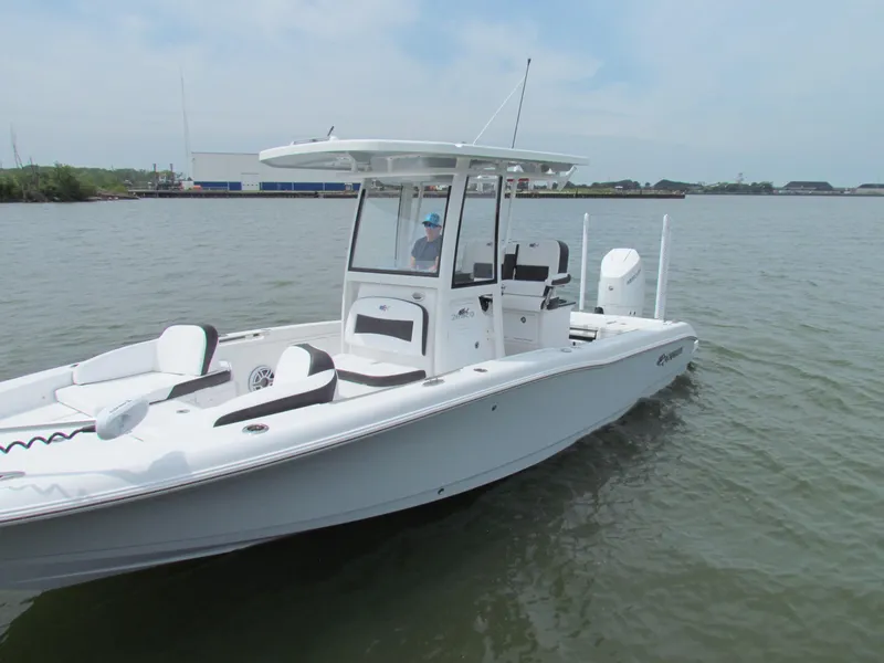 Slide: The Image of 2024 Crevalle 26 HCO boat on calm water, featuring sleek design and modern amenities. - 15