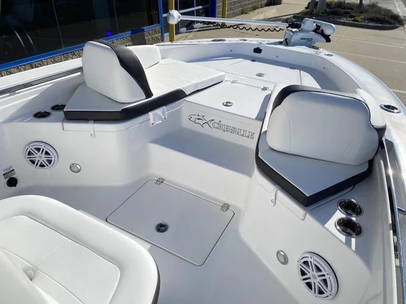 Slide: The Image of 2024 Crevalle 26 HCO boat interior with white seating and modern design. - 18