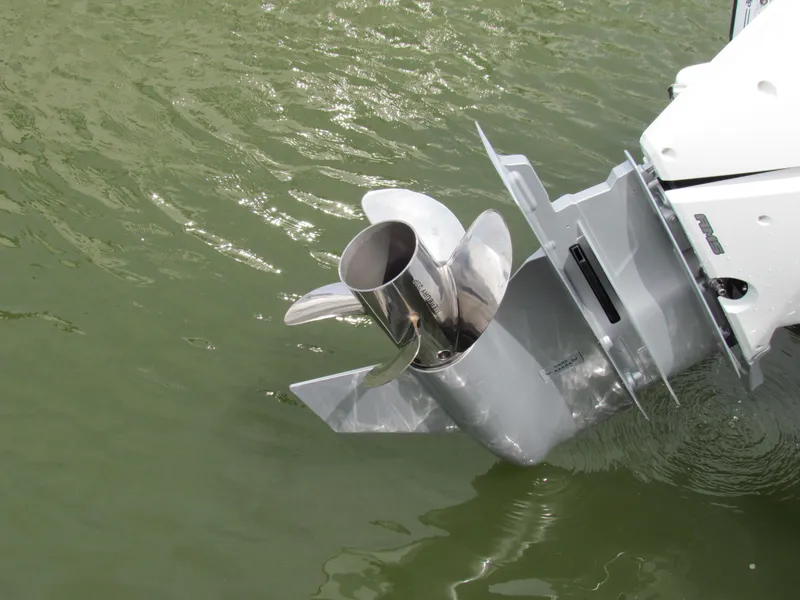 Slide: The Image of 2024 Crevalle 26 HCO boat propeller submerged in water. - 19