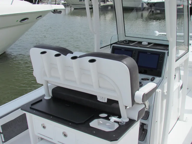 Slide: The Image of 2024 Crevalle 26 HCO boat console with seating and navigation equipment. - 5