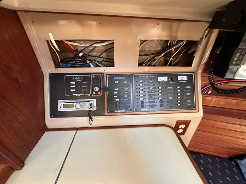 Slide: The Image of Electrical panel of a 1987 C&C 34 sailboat, showing wiring and control switches. - 10