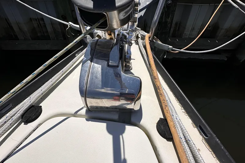 Slide: The Image of Bow of 1987 C&C 34 sailboat with anchor windlass and ropes. - 7