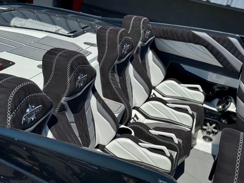 Slide: The Image of 2016 Daves Custom Boats M31 interior with sleek black and white seating. - 13