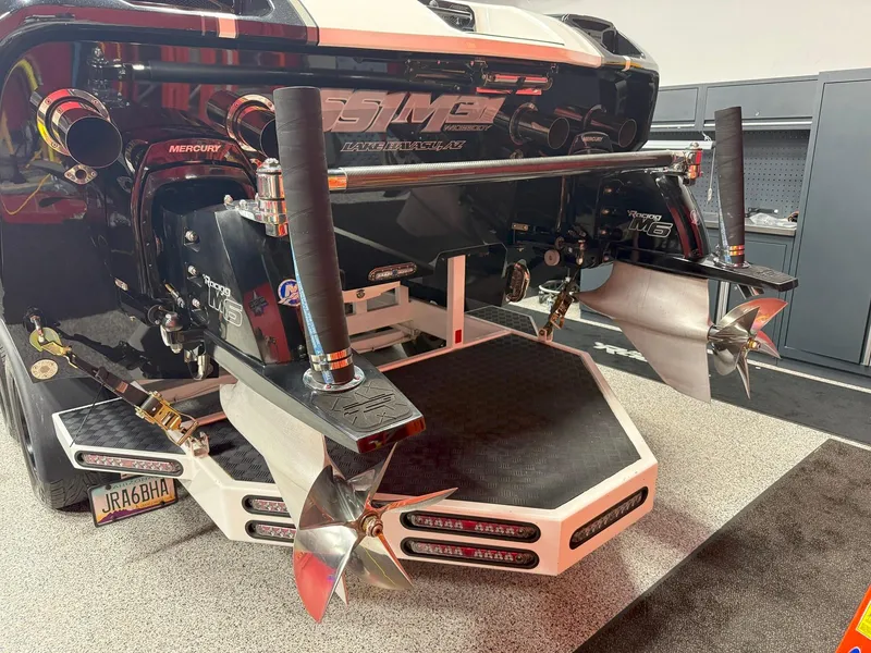 Slide: The Image of 2016 Daves Custom Boats M31 with dual propellers in a garage setting. - 19