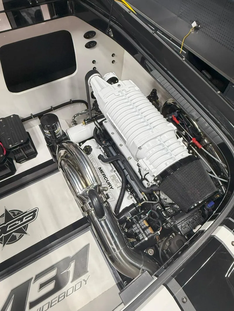 Slide: The Image of 2016 Daves Custom Boats M31 engine compartment with high-performance components and sleek design. - 22