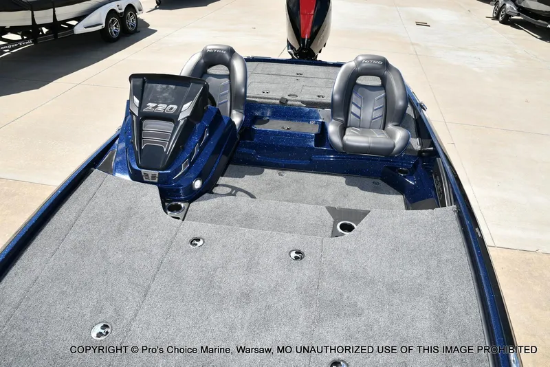 Slide: The Image of 2021 Nitro Z20 boat interior with dual seats and carpeted deck. - 11