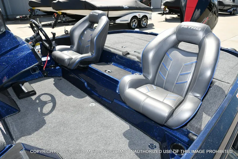 Slide: The Image of 2021 Nitro Z20 boat interior with two gray seats and steering wheel. - 15