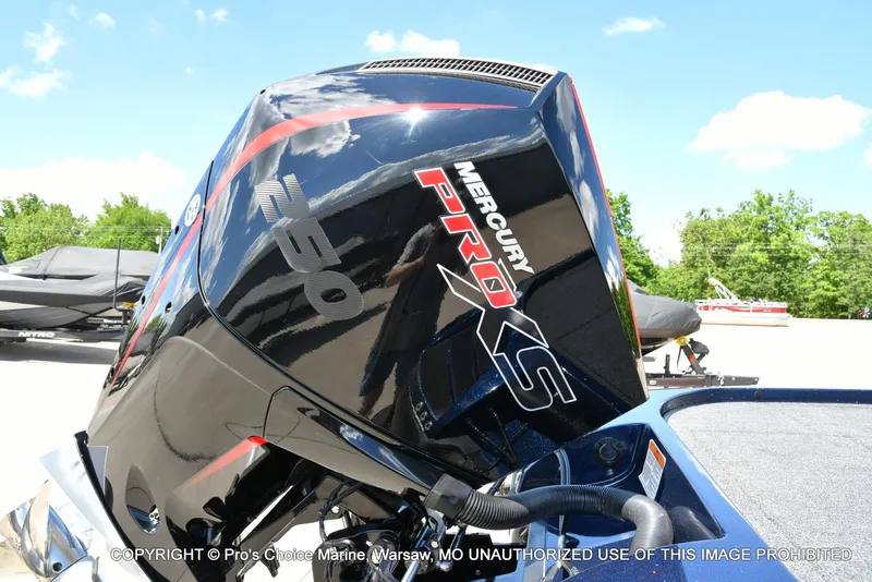 Slide: The Image of 2021 Nitro Z20 boat with Mercury Pro XS engine, outdoors on a sunny day. - 19