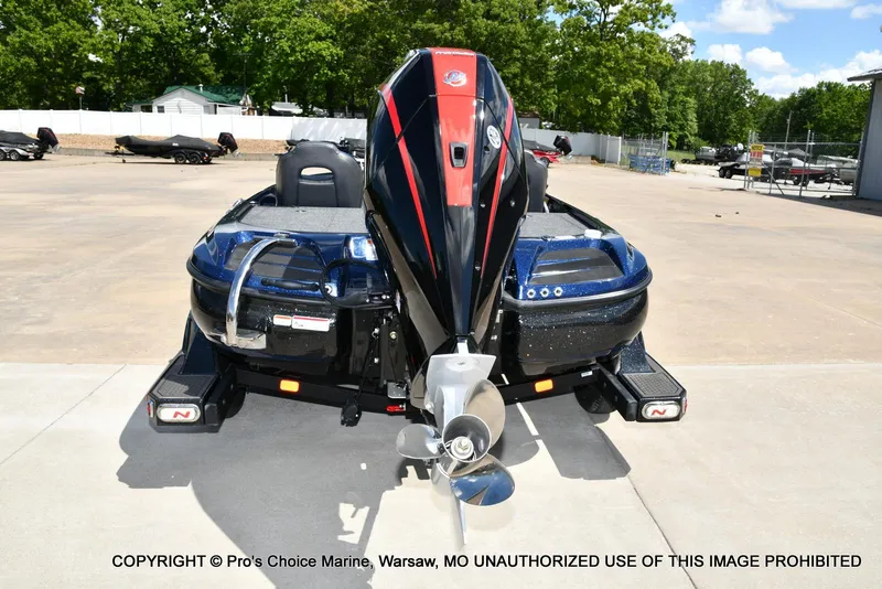 Slide: The Image of 2021 Nitro Z20 boat with powerful outboard motor in a sunny outdoor setting. - 25