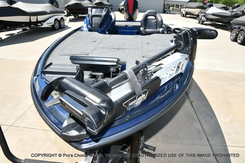 Slide: The Image of 2021 Nitro Z20 boat with Minn Kota trolling motor, parked outdoors. - 30