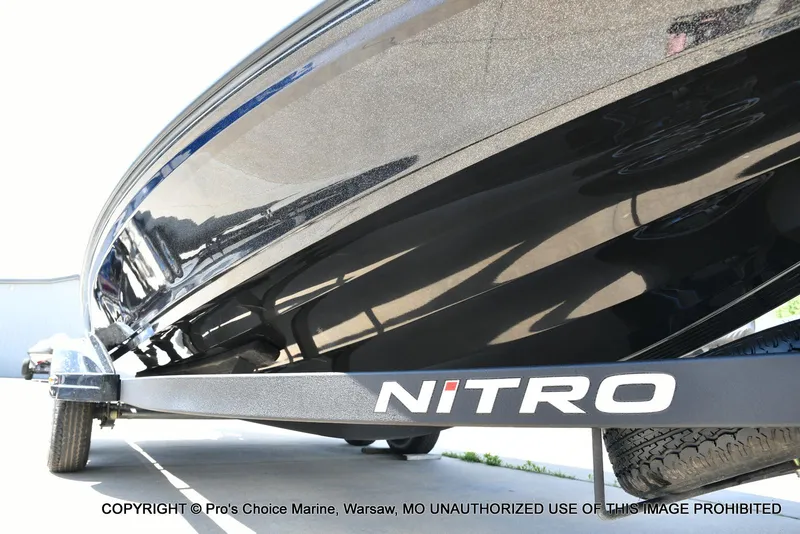 Slide: The Image of 2021 Nitro Z20 boat on trailer, close-up view of hull and branding. - 33