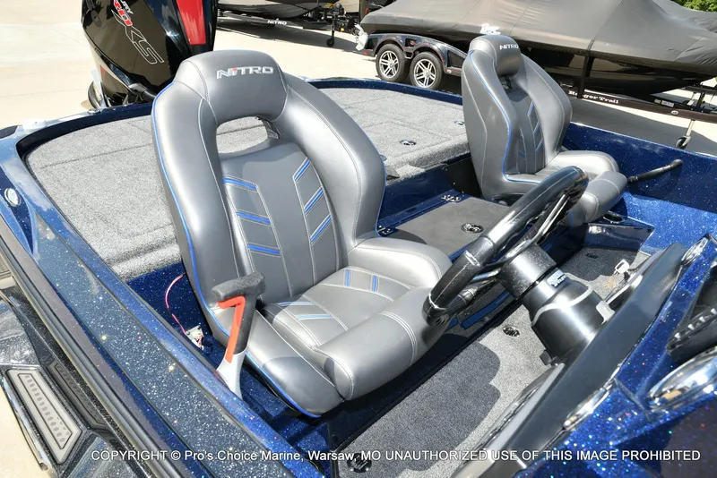 Slide: The Image of 2021 Nitro Z20 boat interior with gray seats and steering wheel. - 37