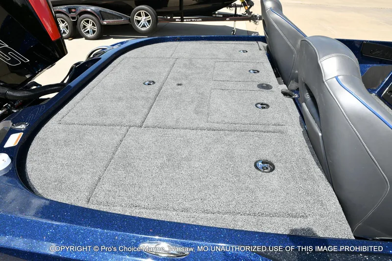 Slide: The Image of 2021 Nitro Z20 boat deck with gray carpet and storage compartments. - 38