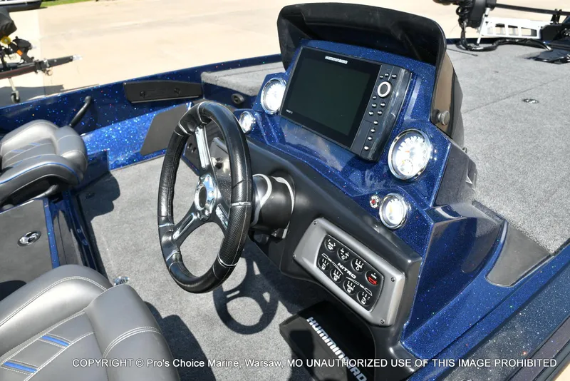 Slide: The Image of 2021 Nitro Z20 boat dashboard with steering wheel and electronic display. - 39