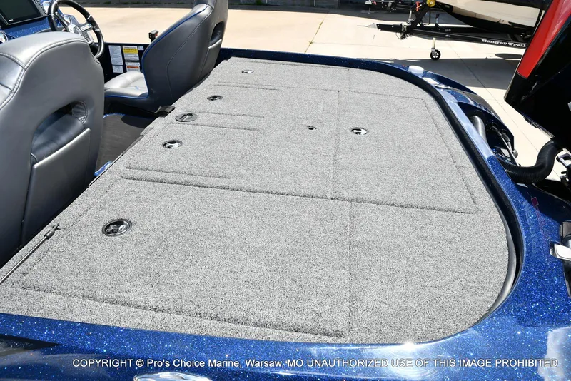 Slide: The Image of 2021 Nitro Z20 boat interior with carpeted deck and seating. - 40