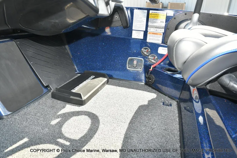 Slide: The Image of Interior of a 2021 Nitro Z20 boat, featuring control panel and seating area. - 45