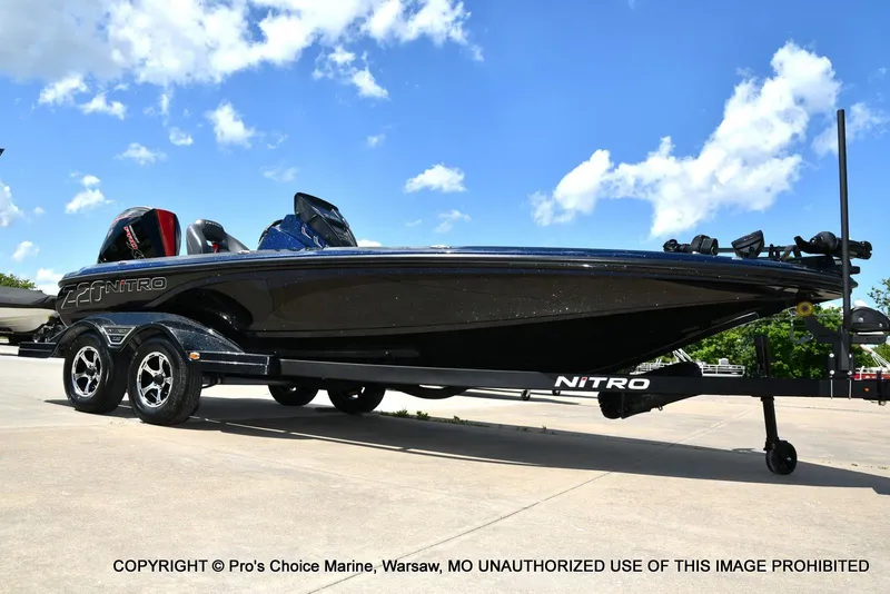 Slide: The Image of 2021 Nitro Z20 boat on trailer under blue sky. - 77