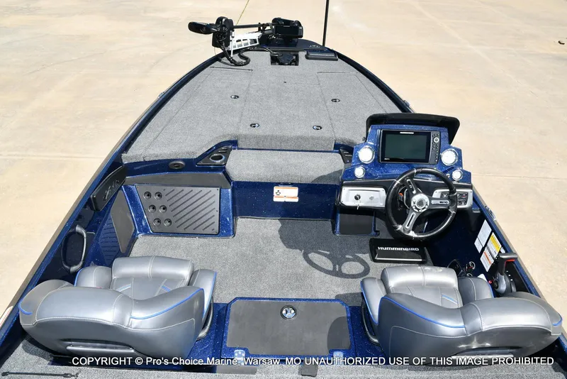 Slide: The Image of 2021 Nitro Z20 boat interior with steering console, seats, and navigation equipment. - 8