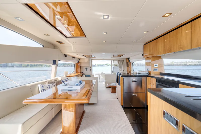 Slide: The Image of Luxurious interior of 2012 Sunseeker Manhattan 63 yacht with elegant wood finishes and spacious seating. - 34