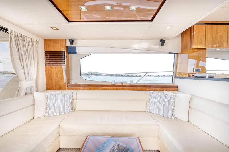 Slide: The Image of Luxurious interior of 2012 Sunseeker Manhattan 63 yacht with elegant seating and large window view. - 35