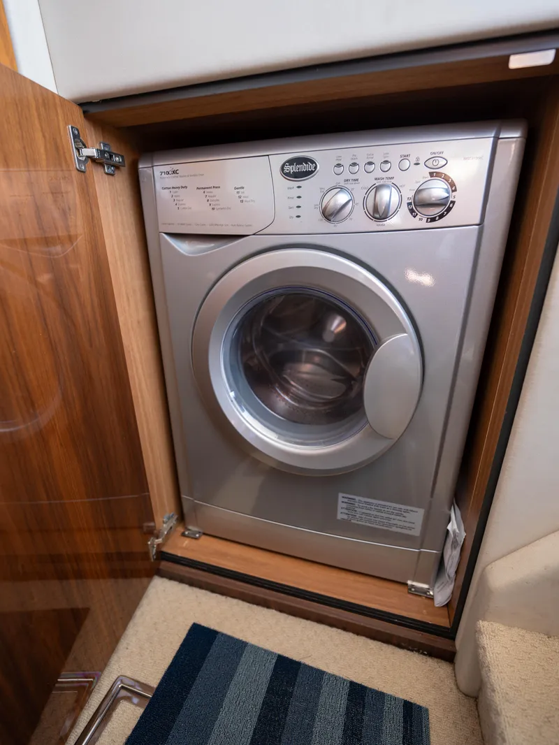 Slide: The Image of Washing machine in 2012 Sunseeker Manhattan 63 yacht interior. - 38
