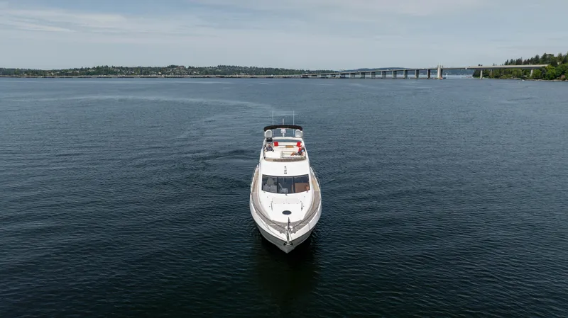 Slide: The Image of Sunseeker Manhattan 63 yacht cruising on open water, 2012 model. - 5