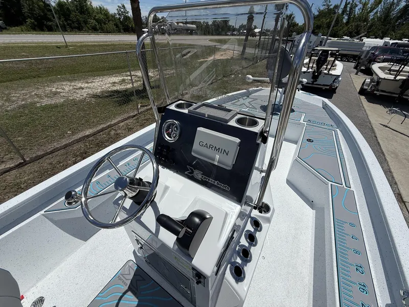 Slide: The Image of 2025 Xpress Hyper-Lift Series H22B boat with Garmin navigation system and sleek console design. - 5