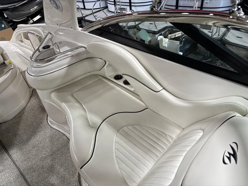 Slide: The Image of Luxurious interior of a 2007 Monterey 298 boat with white leather seating. - 10