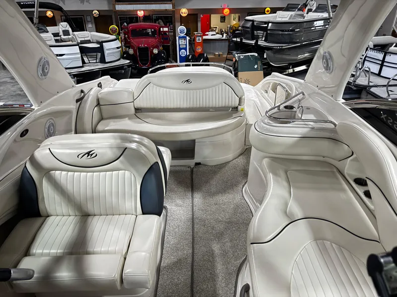 Slide: The Image of 2007 Monterey 298 boat interior with white leather seating and modern design. - 11