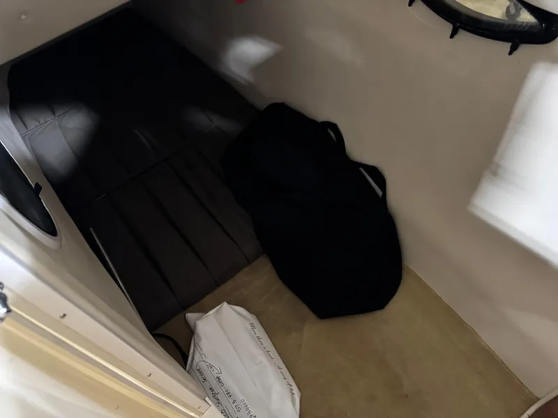 Slide: The Image of Interior of a 2007 Monterey 298 boat with bags on the floor. - 14